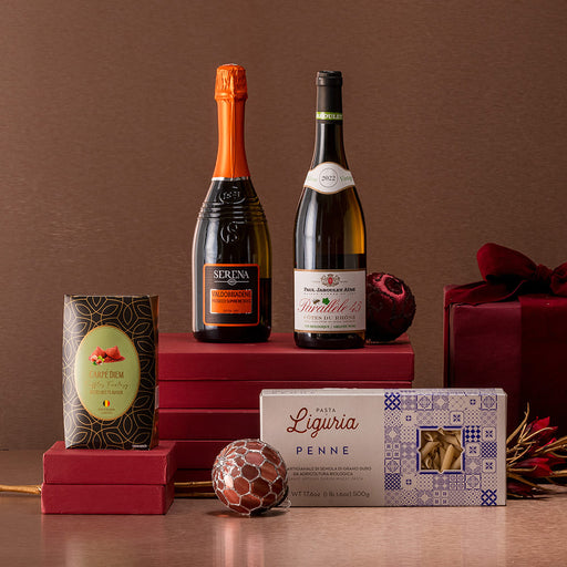 a bottle of prosecco and a bottle of white win accompanied by premium pasta and belgian chocolate christmas hampers malta