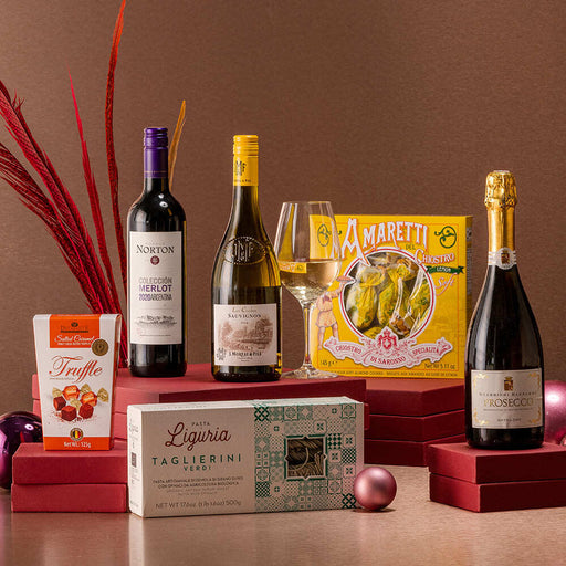 A bottle of proseccoo, a bottle of new Agrentinian Merlot red wine and french sauvignon blanc accompanied by amaretti, chocolate truffles and premium italian pasta. 