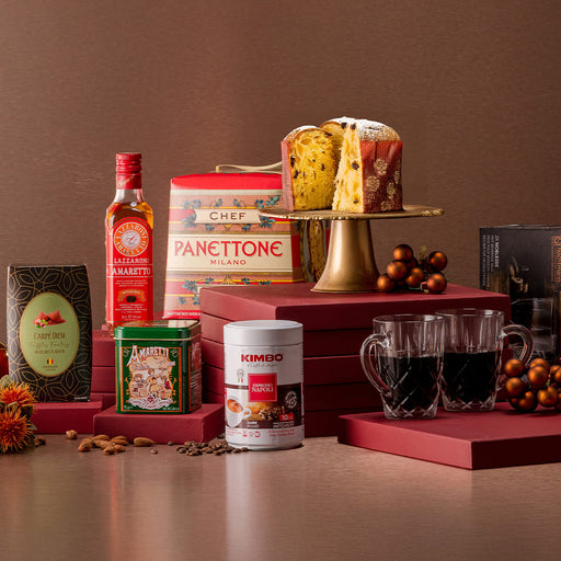 Beautiful panettone with a tin of Kimbo Coffee , a box of amaretti and a bottle of Lazzaroni Amaretto. 