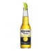 Corona Extra beer bottle with a lime wedge on a white background